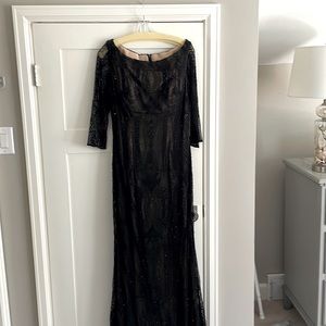 Ball gown.  Black beaded lace over nude lining.  Worn once.
